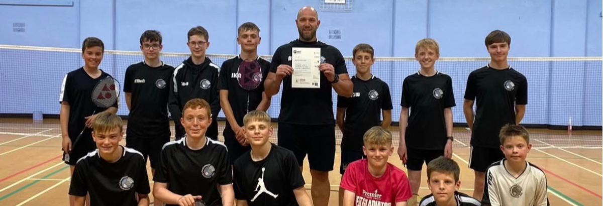 Barry Wilkinson 1200 Barry Wilkinson holds his Level three coach certificate with his students