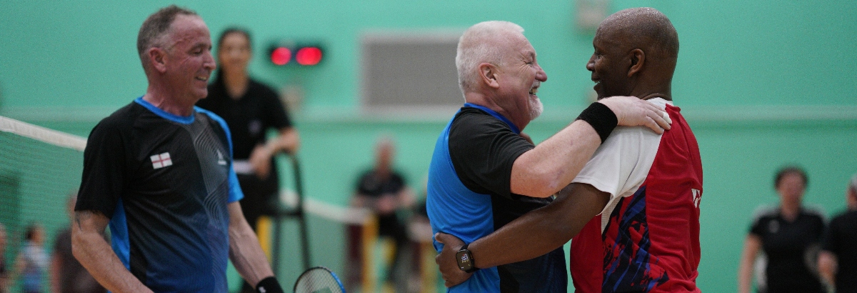 Men's doubes exchange hugs in the YONEX All England Senior Championships